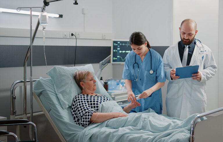 A Doctor And Nurse With Patient