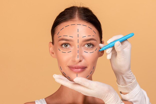 concept-plastic-surgery-lady-changing-her-appearance-cosmetology-clinic-plastic-surgeon-making-marks-her-face